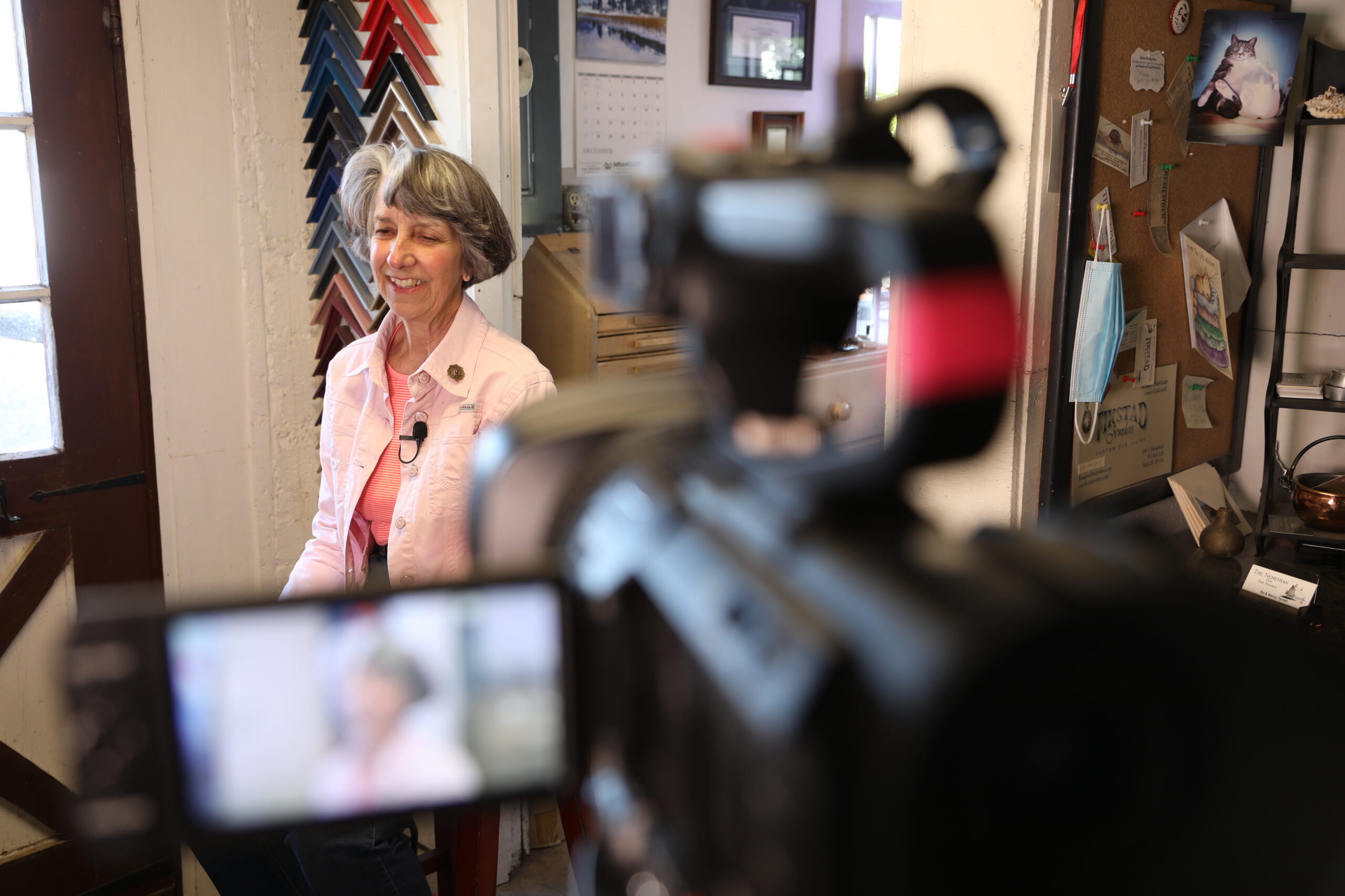 Nancy T. is smiling at the camera while being interviewed by ISBDC South Central Regional Director, Bryan Matsuoka